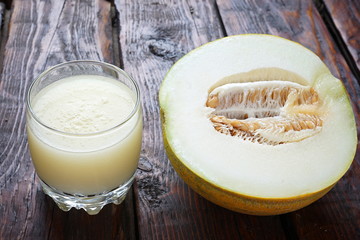 melon smoothie on a dark wooden table