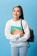 Fototapeta premium Nice female student smiling and looking at camera