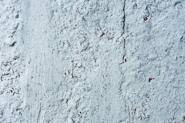 Texture of a concrete wall with cracks and scratches which can be used as a background
