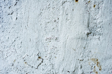 Texture of a concrete wall with cracks and scratches which can be used as a background