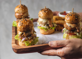 Mini burgers in a wooden tray