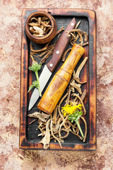 Rhizomes inula on cutting board