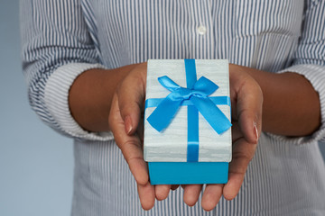 Close up view of blue with ribbon gift box