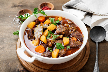Beef meat  stewed with potatoes, carrots and spices (hungarian goulash).
