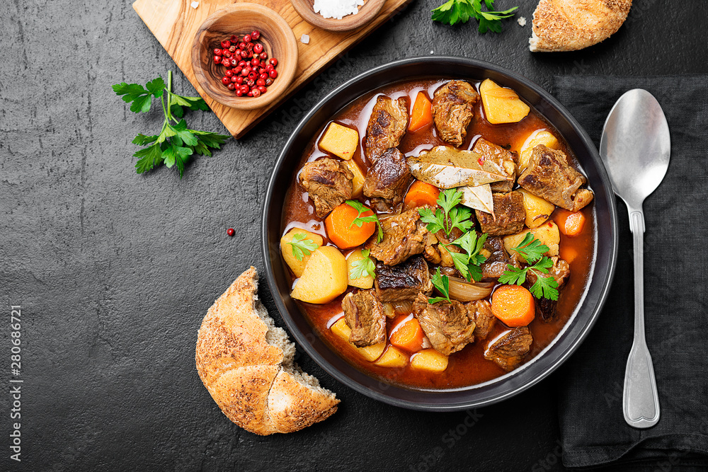 Wall mural beef meat stewed with potatoes, carrots and spices (hungarian goulash).