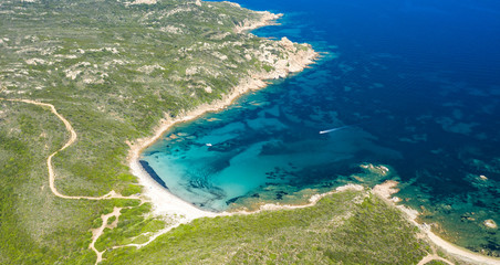 View from above, stunning aerial view of a beautiful beach bathed by a turquoise clear sea. Spiaggia del Principe, Costa Smeralda (Emerald Coast) Sardinia, Italy.