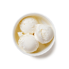 Bowl of vanilla ice cream isolated on white background.