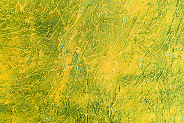  The background texture of the textured wall is yellow and green. Stylized textural banner with space for text.