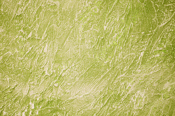 The background texture of the textured wall is a pale olive color. Stylized textural banner with space for text.