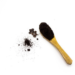 Coffee powder in wooden spoon.