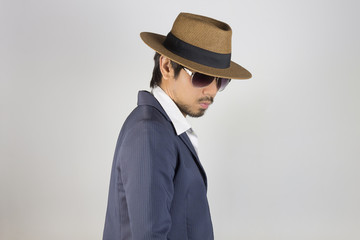 Portrait Man in Navy Blue Suit and White Shirt and Hat and Glasses on Right Pose