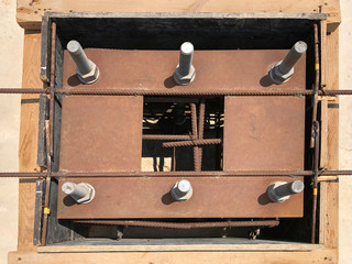 Formwork and reinforcement of concrete reinforced foundation with metal anchor bolts designed for...