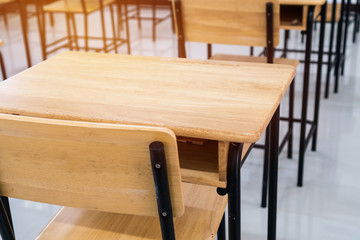 School empty classroom or Lecture room with desks chairs iron wood for studying lessons seminar in university of thailand, interior of class with whiteboard no kid  teacher, educational concept