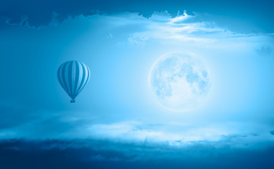 Night sky with moon in the clouds "Elements of this image furnished by NASA