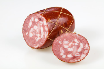 Tasty meat sausages over white background