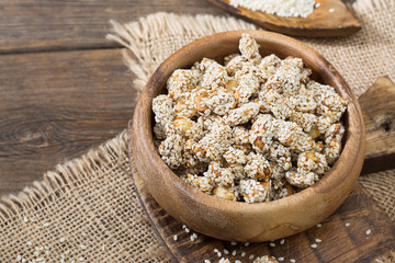 Peanuts roasted in honey and sesame seeds. Rustic style