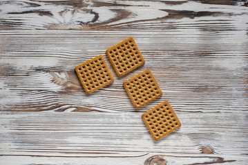 Shortbread cookies on a light wooden background.