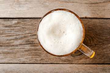 Beer glass on an old wooden table.