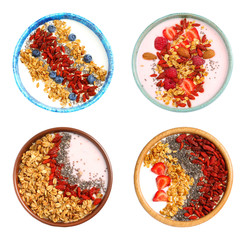 Set of delicious healthy desserts with goji berries on white background, top view