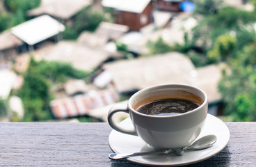 cup of coffee on wooden table
