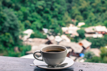 cup of coffee on wooden table