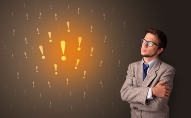 Young person standing with exclamation sign concept