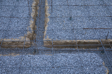 Plastic reinforcement fixers.  Iron wire mesh for concreting floors of buildings. Stacked Rebar...