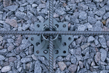 Plastic reinforcement fixers.  Iron wire mesh for concreting floors of buildings. Stacked Rebar...