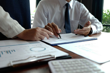 Close-up, businessmen, accountants, businessmen, financiers, bankers, sit and stand near, work, business consulting, business planning, adding ideas and checking accounts