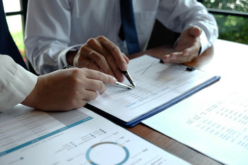 Close-up, businessmen, accountants, businessmen, financiers, bankers, sit and stand near, work, business consulting, business planning, adding ideas and checking accounts