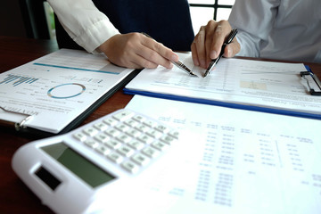 Close-up, businessmen, accountants, businessmen, financiers, bankers, sit and stand near, work, business consulting, business planning, adding ideas and checking accounts