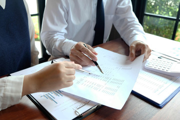 Close-up, businessmen, accountants, businessmen, financiers, bankers, sit and stand near, work, business consulting, business planning, adding ideas and checking accounts