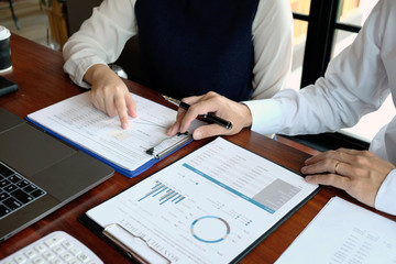 Close-up, businessmen, accountants, businessmen, financiers, bankers, sit and stand near, work, business consulting, business planning, adding ideas and checking accounts