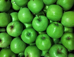 many green apples at the market
