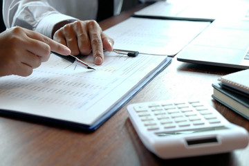 Close-up, businessmen, accountants, businessmen, financiers, bankers, sit and stand near, work, business consulting, business planning, adding ideas and checking accounts