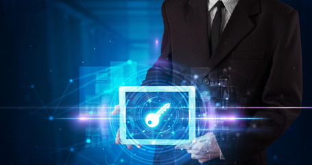 Hand holding tablet with online security and data protection concept