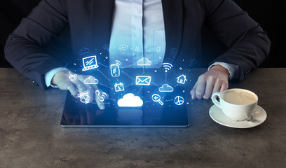 Business woman working on tablet with application and cloud technology concept