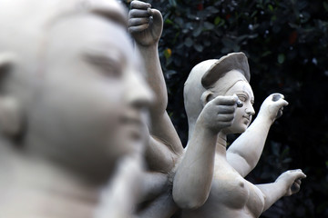 Idol of Hindu Goddess Durga during preparations in Kolkata. Clay idol of Goddess Durga, under preparation for Bengal's Durga Puja festival at Kumartuli Kolkata. Durga Puja is biggest festival in India