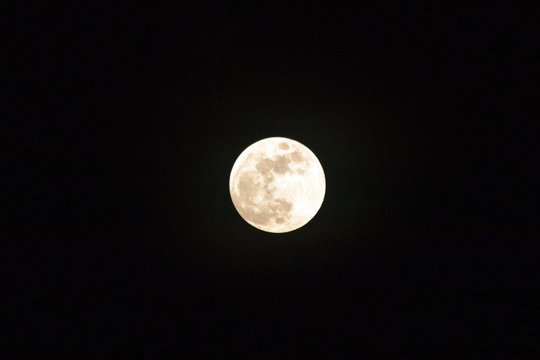Full moon shining glowing light the night sky