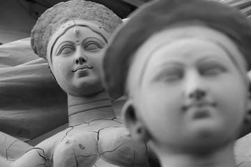Idol of Hindu Goddess Durga during preparations in Kolkata. Clay idol of Goddess Durga, under...