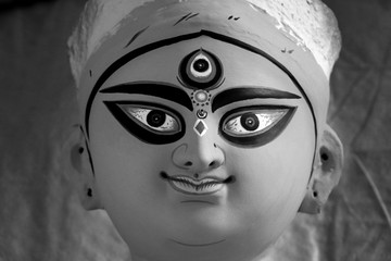 Idol of Hindu Goddess Durga during preparations in Kolkata. Clay idol of Goddess Durga, under...