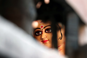 Idol of Hindu Goddess Durga during preparations in Kolkata. Clay idol of Goddess Durga, under preparation for Bengal's Durga Puja festival at Kumartuli Kolkata. Durga Puja is biggest festival in India