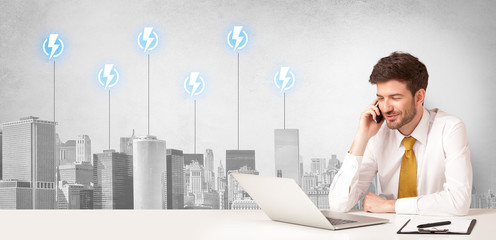 Announcer sitting at desk presenting the city energy consumption