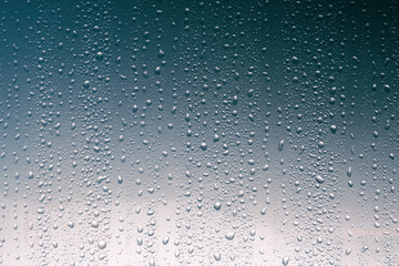 Water drops on glassy background