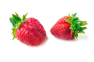 Two strawberries close up on white background