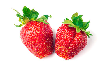 Two strawberries close up on white background