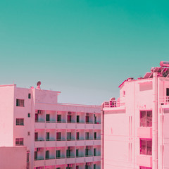 Houses of the seaside town. Tropical and exotic location. Infrared pink style.