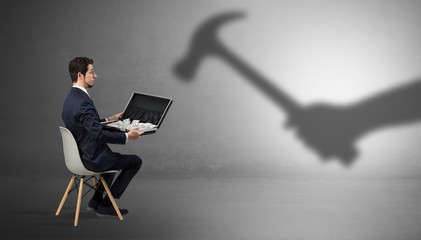 Small businessman staying and offering stuffs for an armed shadow hand
