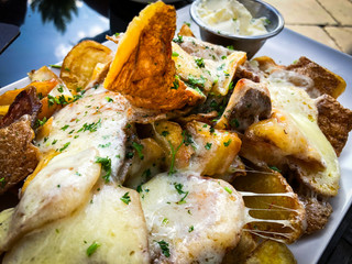 baked potatoes and melted cheese topping