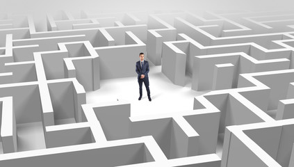 Young businessman standing in a middle of a 3D maze